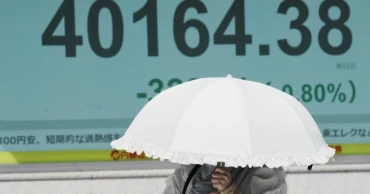 Asian shares are mostly higher, tracking US rally into record heights