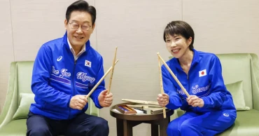 Japan, South Korea leaders drum to K-pop after summit