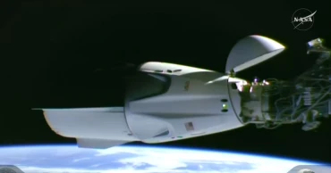 Astronauts reach the space station on the fastest US flight yet.