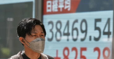 Asian shares gain after Wall Street’s rally, but hopes are tempered by trade war uncertainties