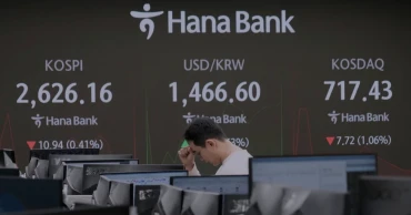 Asian shares mostly lower after tech-driven Wall Street gain