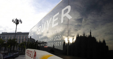 Virus closes doors at Armani, but other Milan shows go on