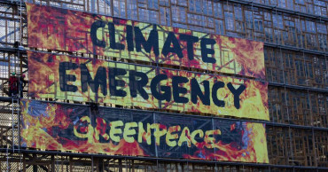 Climate activists lashed to EU building as leaders gather