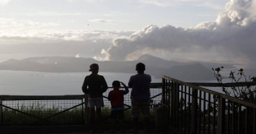 Philippine volcano spews lava, ash for 3rd day, 30,000 flee