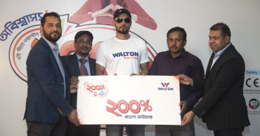 Mashrafe hands over cash voucher to Walton fridge customer
