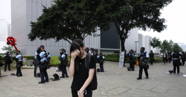 Hong Kong police warn against teachers leading students into violent acts