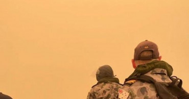 Some flee, others restock before Australia's wildfires grow