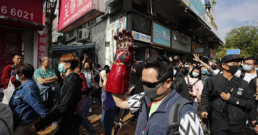 Hong Kong protesters march through border town