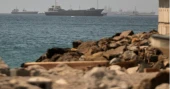 Tanker damaged by projectile in Strait of Hormuz, crew safe