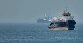 Iran warns the US against attacks on its vessels as fragile ceasefire holds
