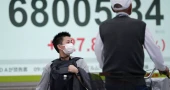 Asian shares fall as US stocks retreat slightly from record highs