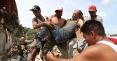 Neighbors search through rubble for survivors after deadly Venezuela earthquakes
