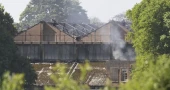 Fire at a former UK military base kills 2 firefighters and a civilian