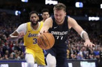 LeBron James has triple-double, Lakers beat Mavs in OT