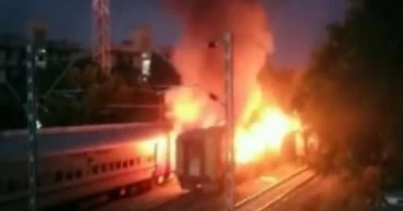Fire inside a parked train's private compartment kills nine in southern India