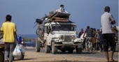 Palestinians flee chaos and panic in Rafah after Israel’s seizure of border crossing