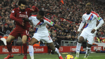 Salah nets 2 as Liverpool beats Palace to keep up title push