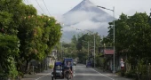 Philippine villagers flee ashfall, sight of red-hot lava from erupting Mayon volcano