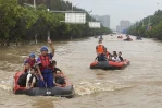 Beijing records heaviest rainfall in at least 140 years, causing severe flooding and 21 deaths