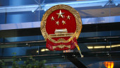 Hong Kong residents deface Chinese emblem in latest protest