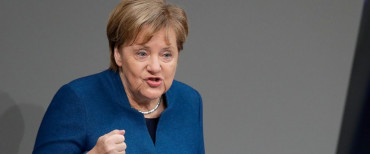 Merkel says UN migrants pact is in Germany's interest