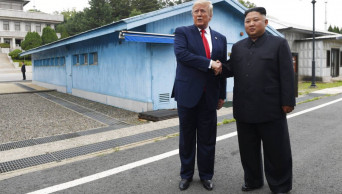Trump, Kim shake hands in historic DMZ meeting