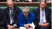 May wins no-confidence vote, but still is beset by Brexit