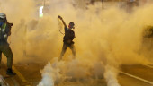 Hong Kong protesters toss Chinese flag, clash with police