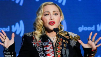 Madonna defends 'disturbing' gun massacre video