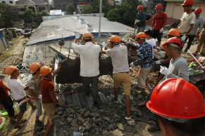 Building under construction topples in Cambodia, killing 17