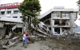 Rescuers detect possible sign of life under quake-hit hotel