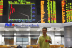 World stocks mixed after IMF trims economic outlook