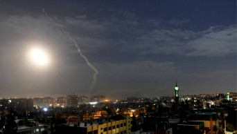 Israel says it hit Iranian military sites in Syria; 11 dead
