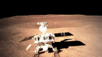 Chinese rover begins making tracks on 'dark' side of moon