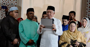 Malaysian ex-PM takes Islamic oath denying murder claim