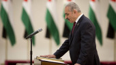 Palestinian president swears in new government