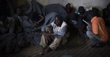 UN Libya migrant center plagued with crowding, TB, food cuts