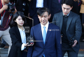 South Korean prosecutors seek arrest of ex-minister's wife