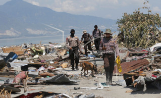 Indonesian quake toll raised to 1,407