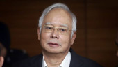 Malaysian ex-PM Najib attends 1st day of graft trial