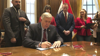 Missouri governor signs bill banning abortions at 8 weeks