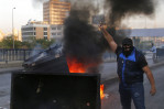 Protesters close roads, paralyzing Lebanon as crisis worsens