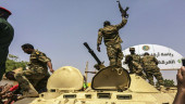 Sudanese army says it holds president, won't extradite him